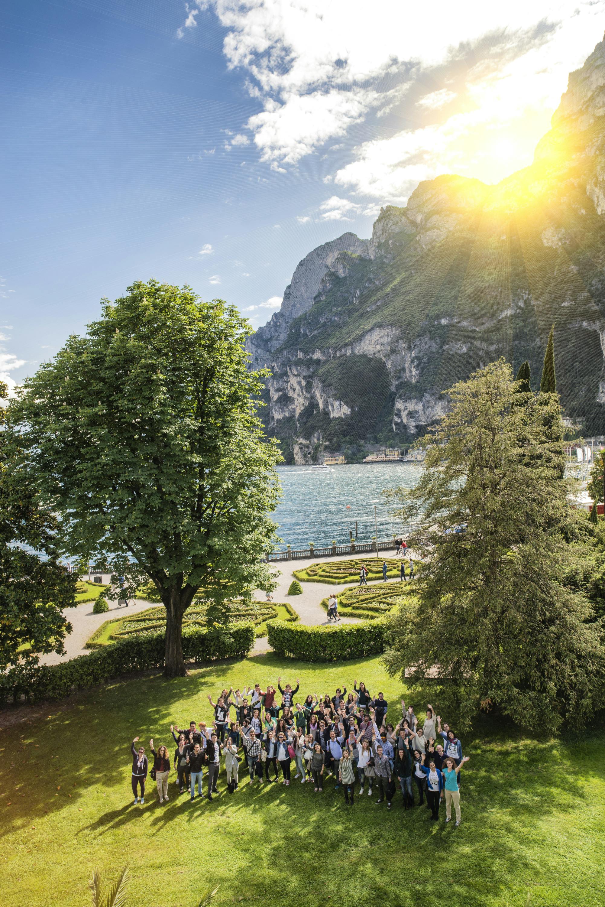 Garden with people and lake in the background