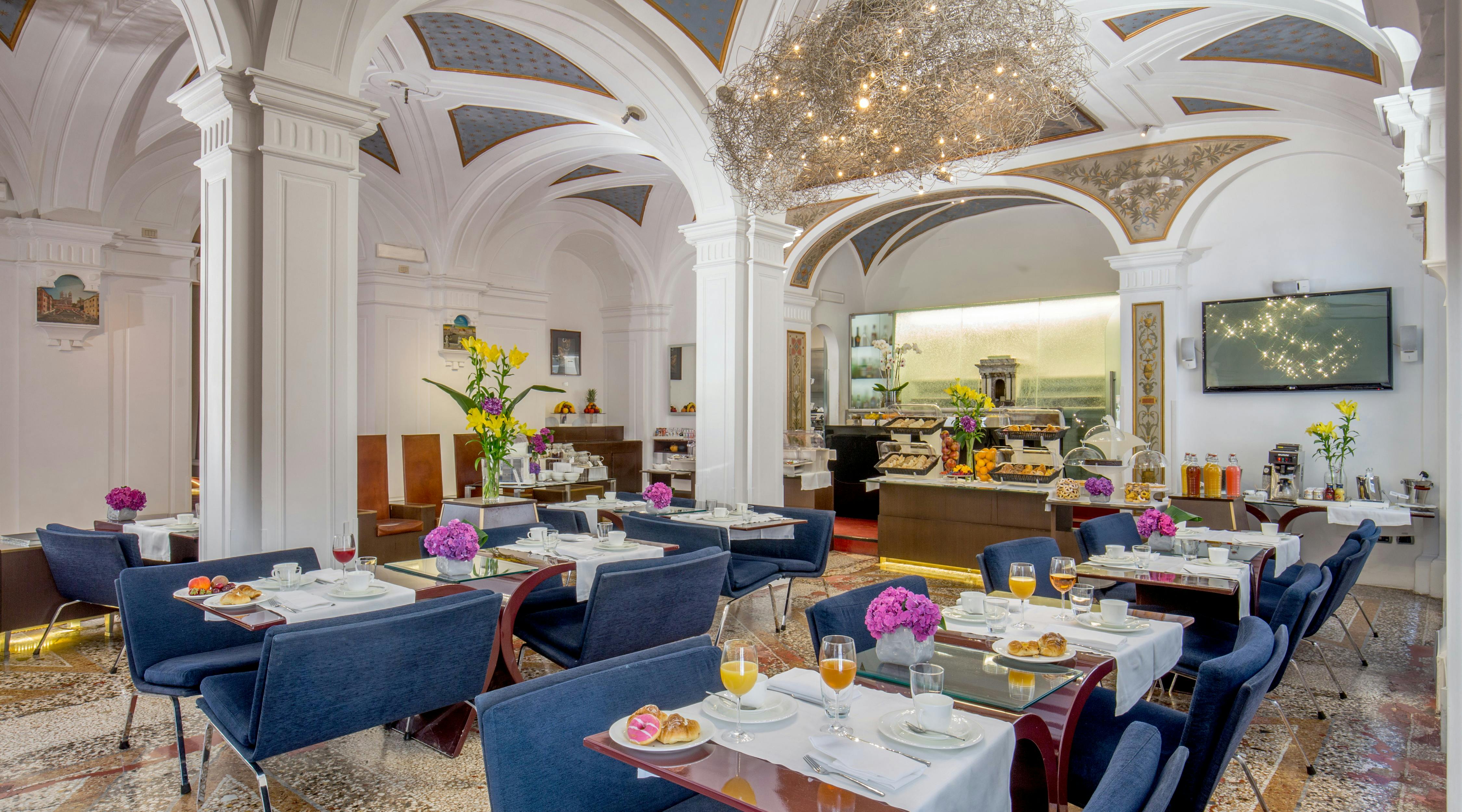 Breakfast room with blue tables and chairs