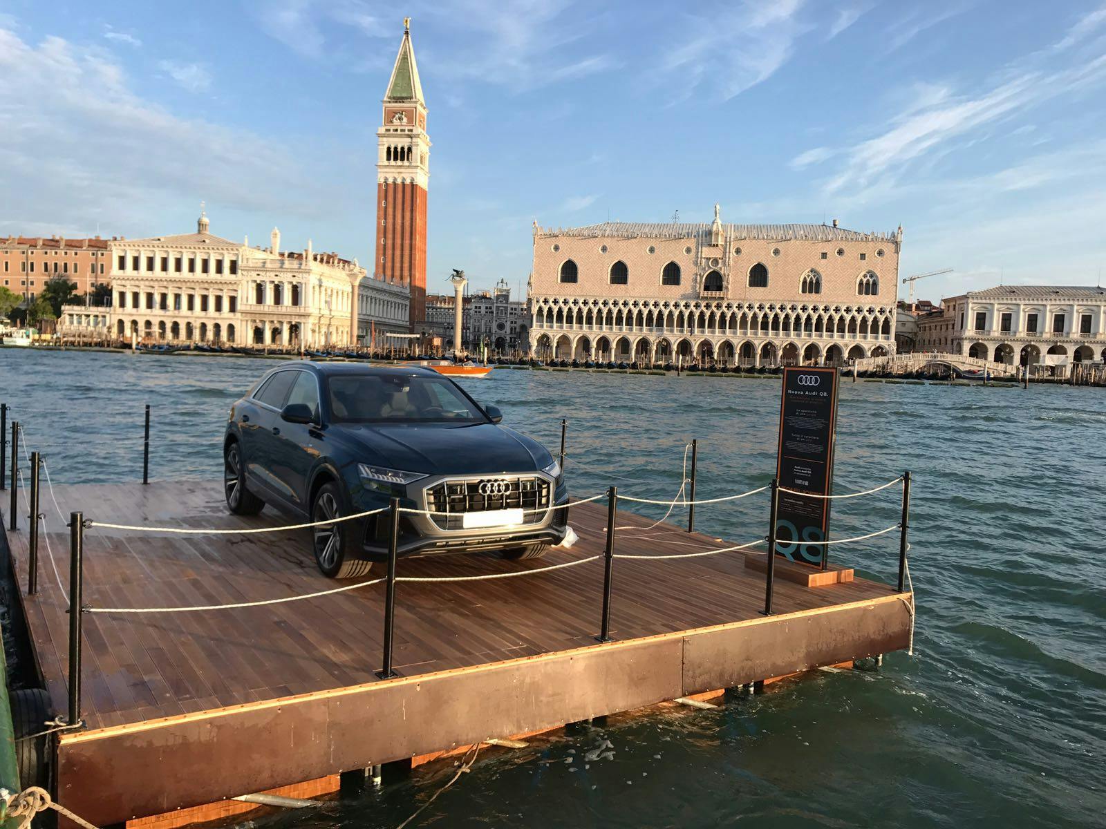 car on platform in water