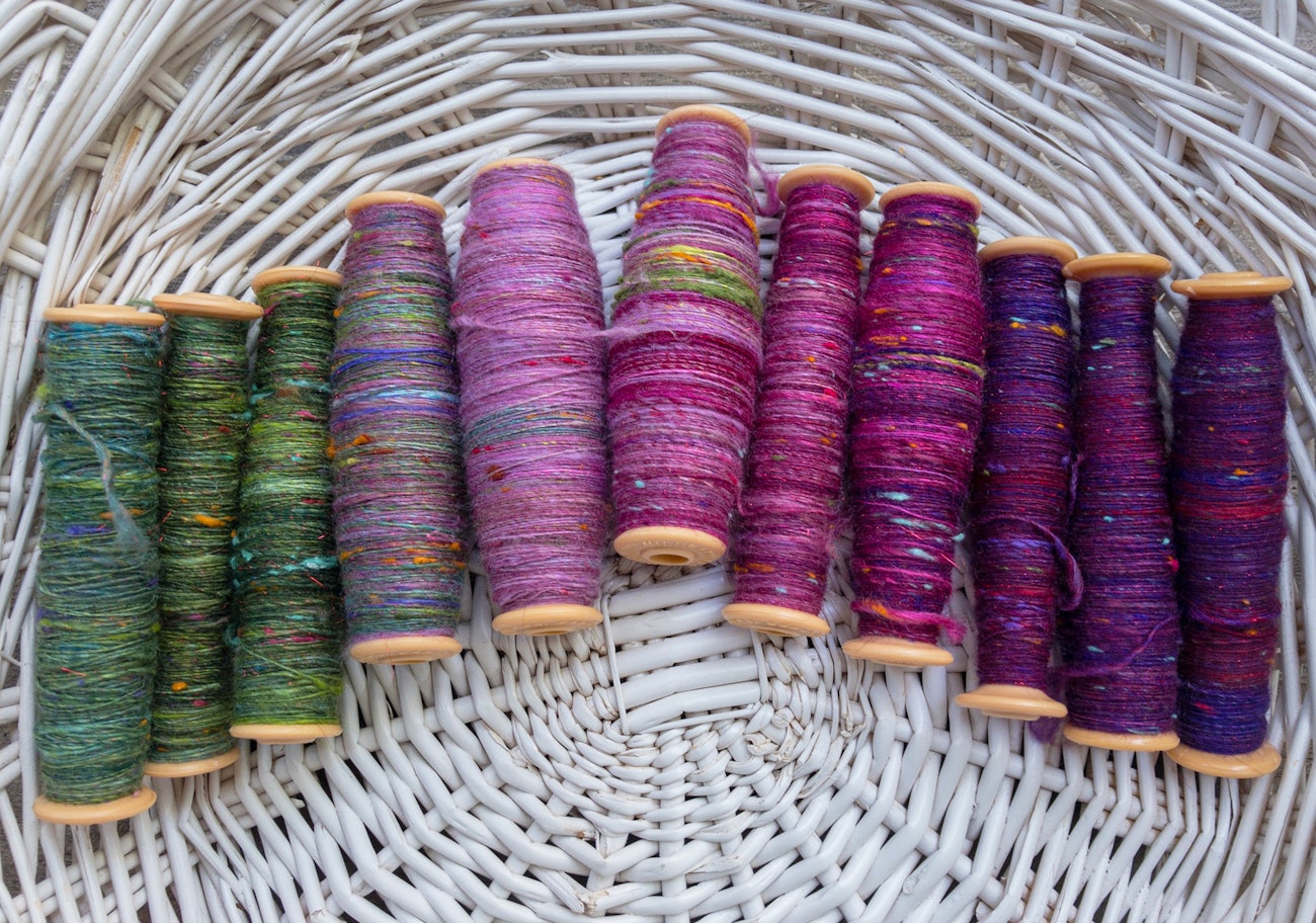 singles wound on weaving bobbins