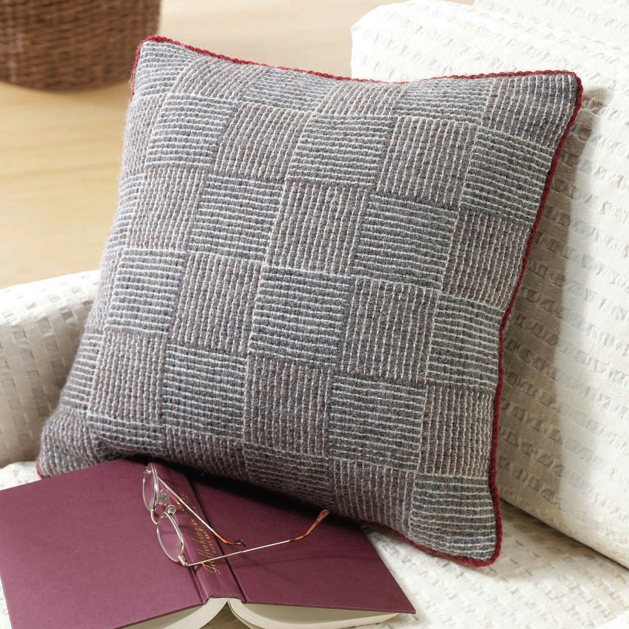 Pillow handwoven in log cabin with natural-colored wool