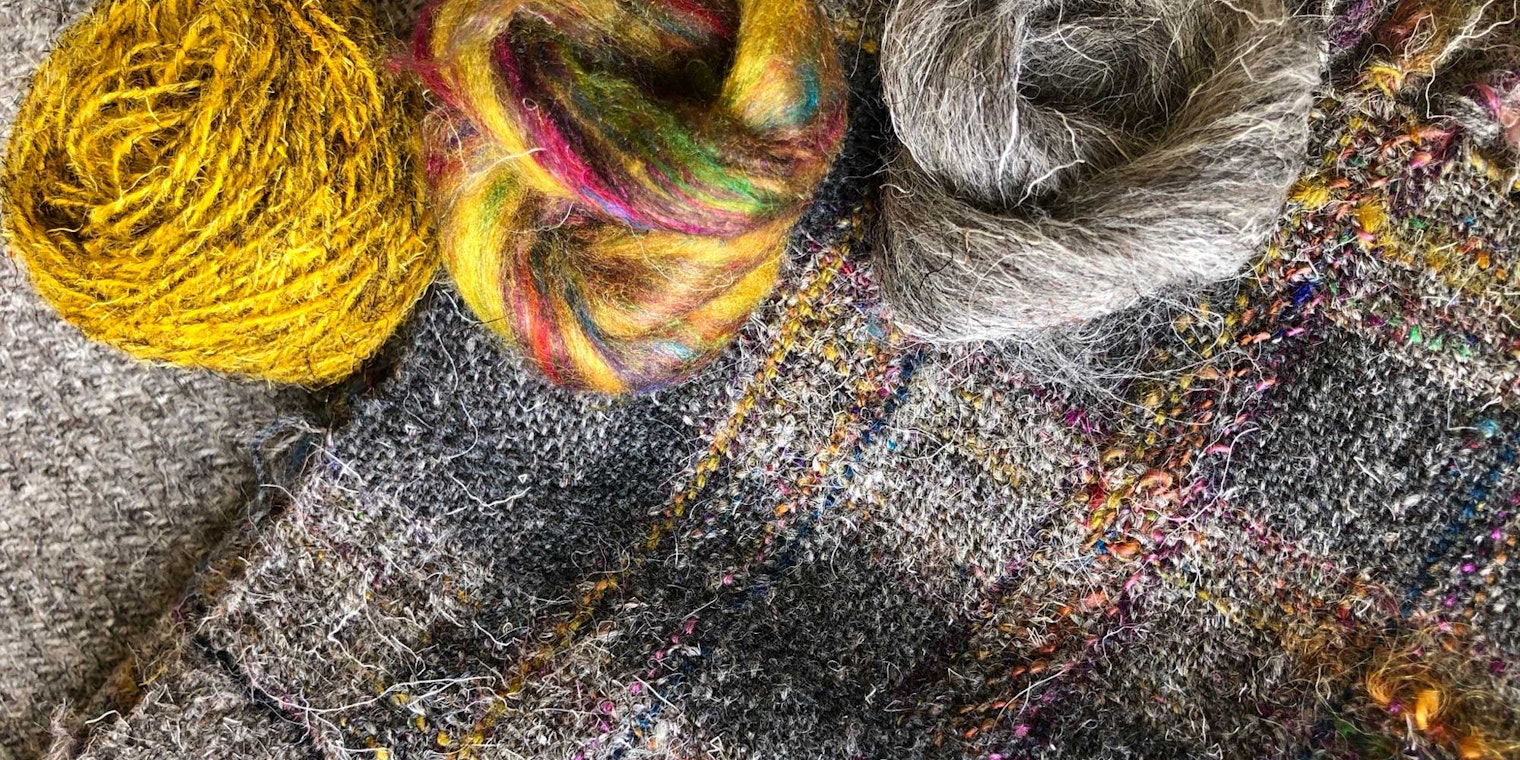 Carole Bowman's sample fabric with overdyed commercial yarn, sari silk, and Herdwick roving; photo courtesy of Carole Bowman