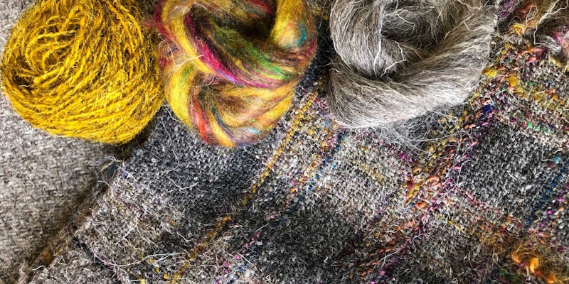 Carole Bowman's sample fabric with overdyed commercial yarn, sari silk, and Herdwick roving; photo courtesy of Carole Bowman