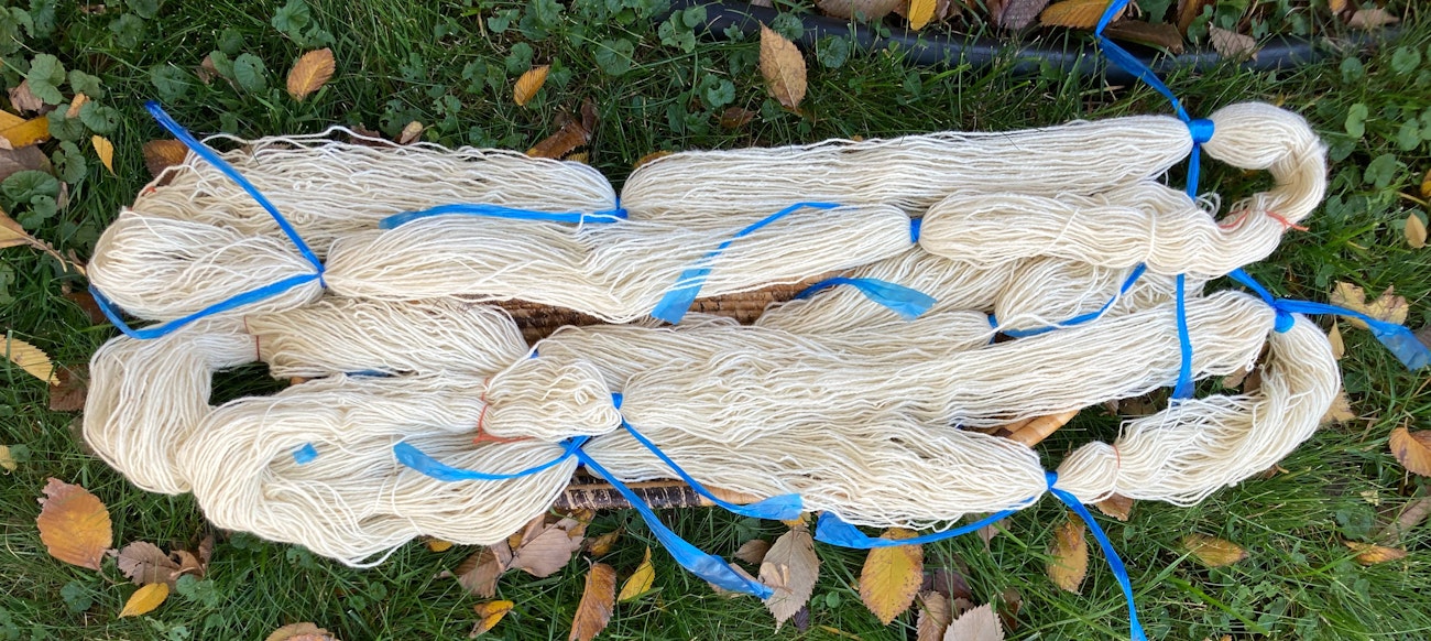 Undyed handspun taped off for dyeing