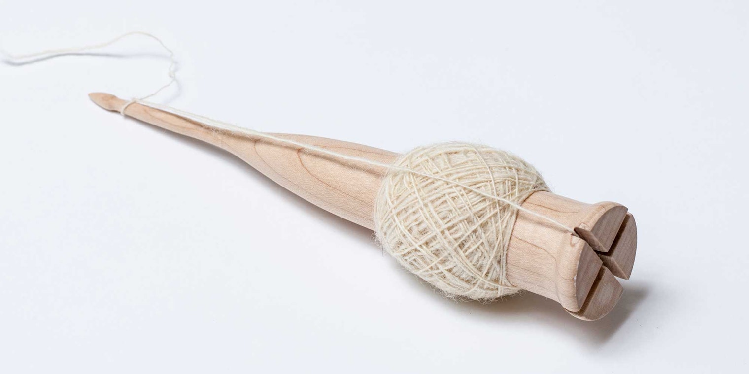 This version of the traditional Scottish drop spindle by Scott Snyder features easy-to-find notches on the bottom that prevent the singles from slipping. This particular spindle also doubles as a nøstepinne. Photos by George Boe