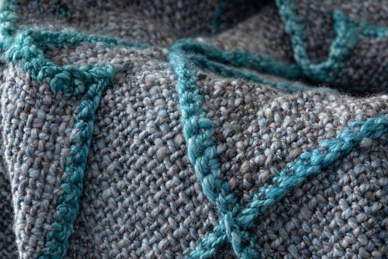 The Stormy Seas Scarf was designed by John Mullarkey and handspun by Devin Helmen. Photo by Matt Graves