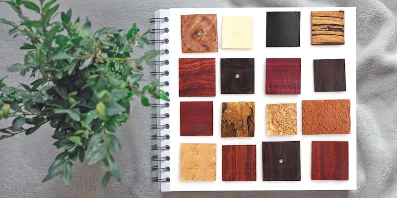 Woods from ordinary to exotic can make for drop-dead gorgeous spindles in the hands of a master spindle maker. Woods from SpindleWood Co. Background photo by Diana Polekhina on Unsplash. Wood photo by Joe Coca
