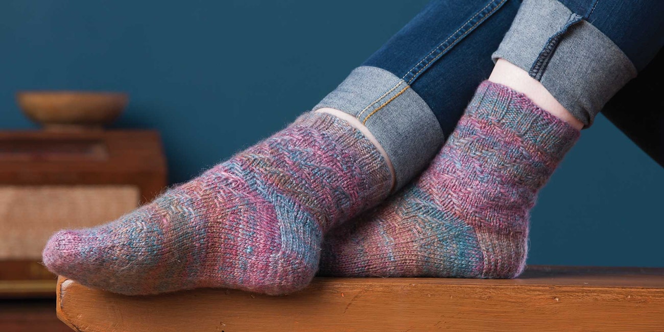 Anne Podlesak spun a Bluefaced Leicester/silk combo for her beautiful Handspun Lida Rose Socks. Photo by Joe Coca