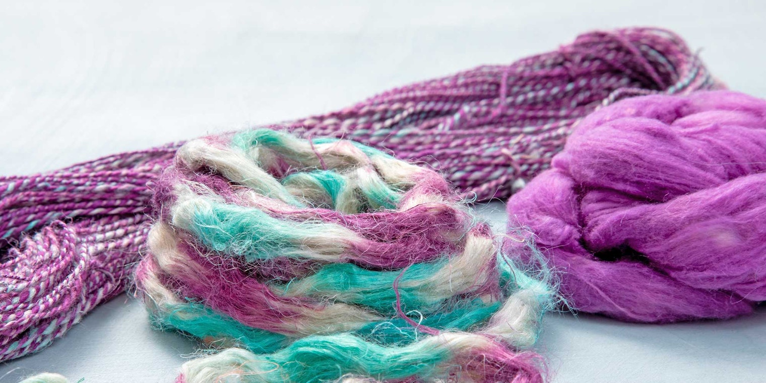 purple fiber and yarn