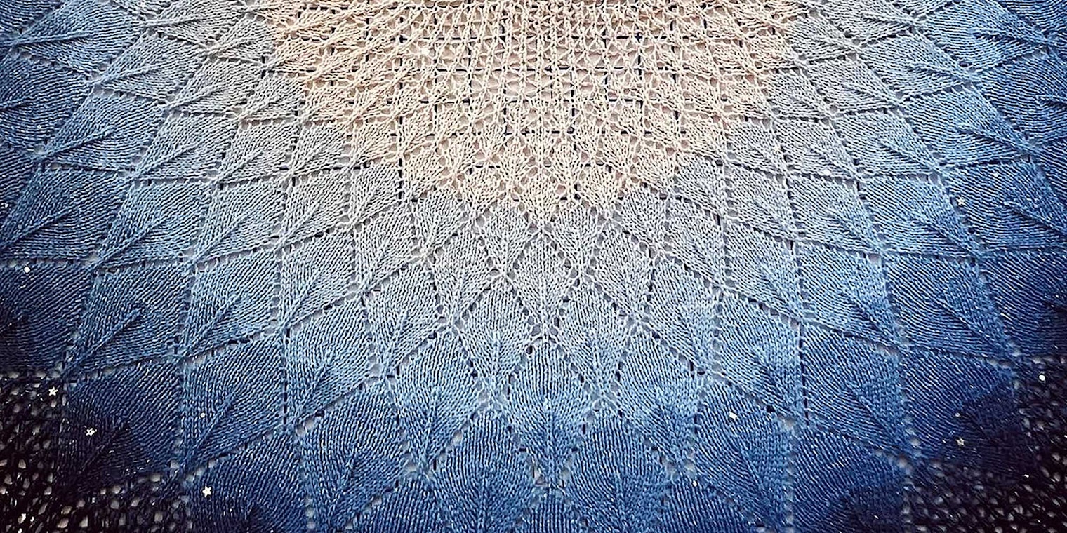 blue and white knitted shawl