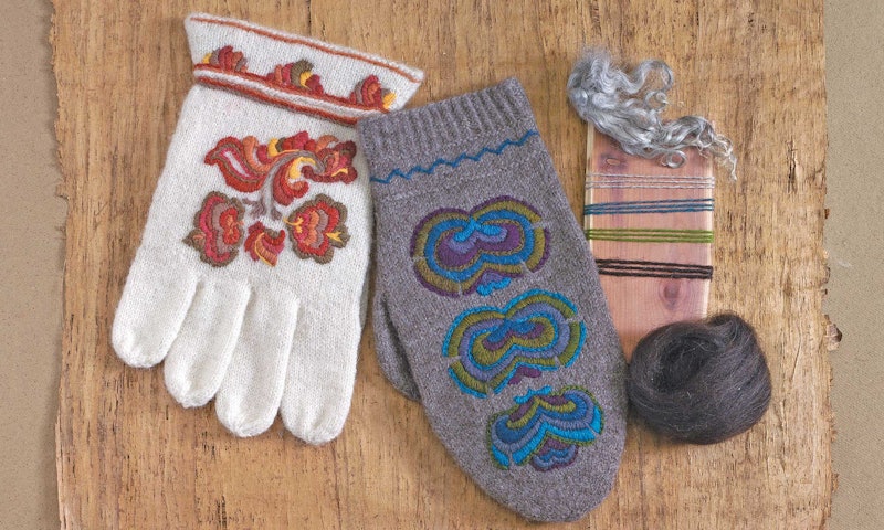 white and gray Norwegian gloves