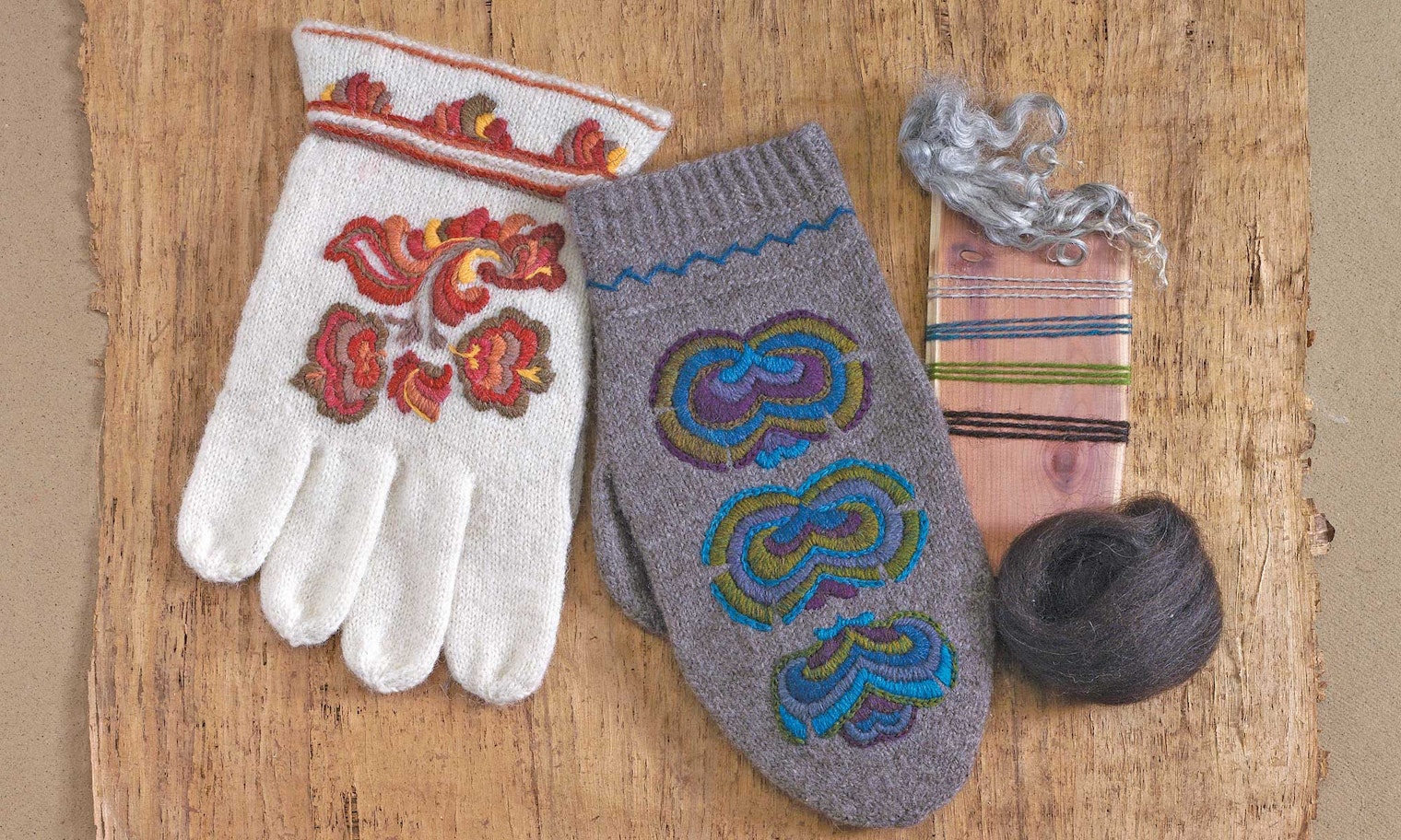 white and gray Norwegian gloves