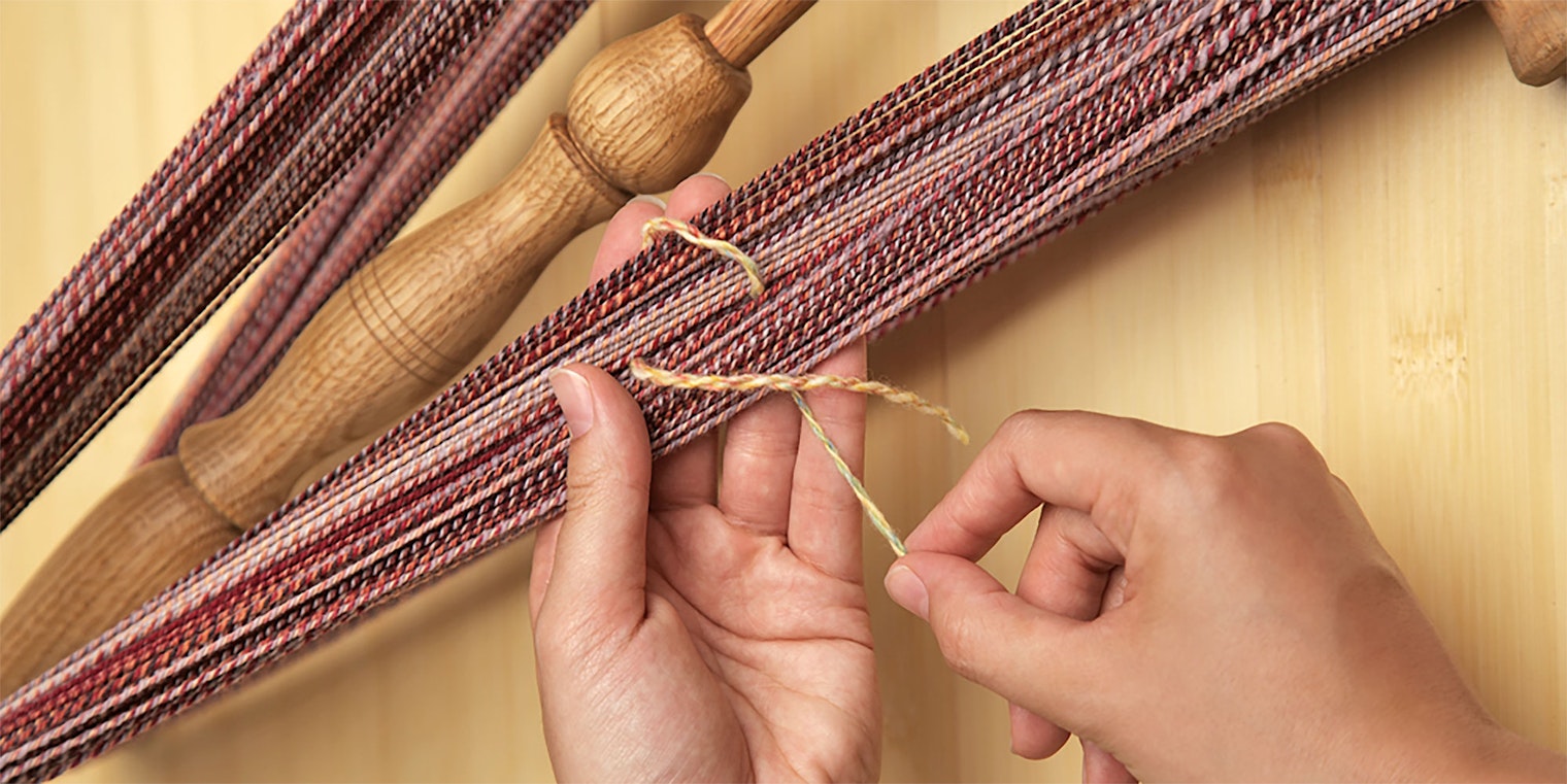 skein of yarn around a niddy-noddy