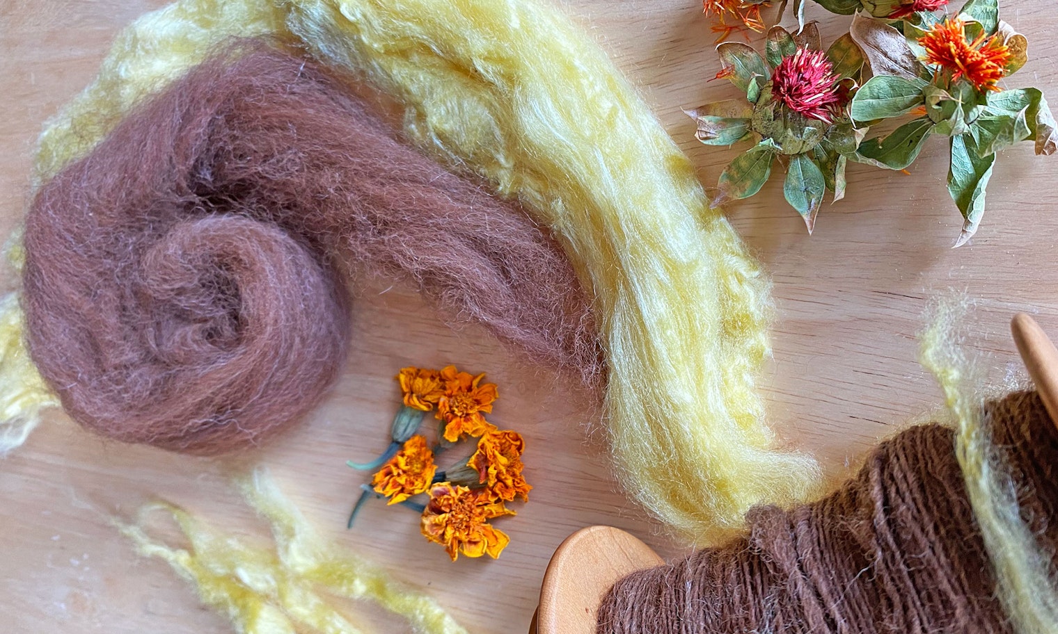 brown and yellow silk for spinning with dried flowers