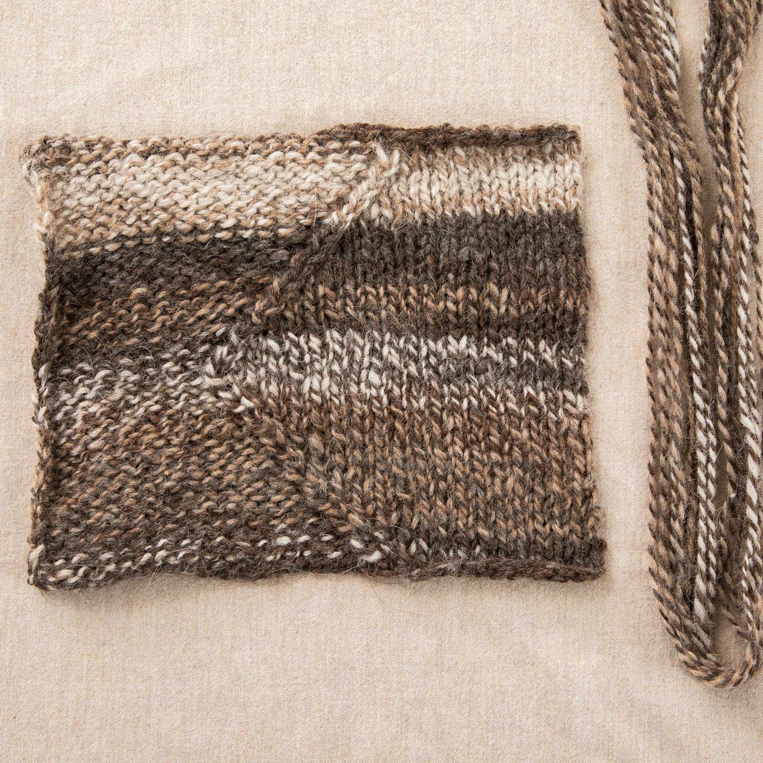 Swatch three uses a marled yarn that makes the stitch pattern difficult to see.