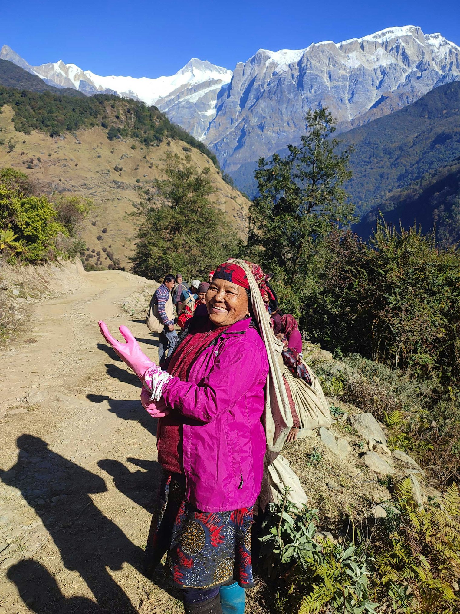 Gin Suba puts on gloves in preparation of cutting and stripping the allo. Photo by Umesh Das