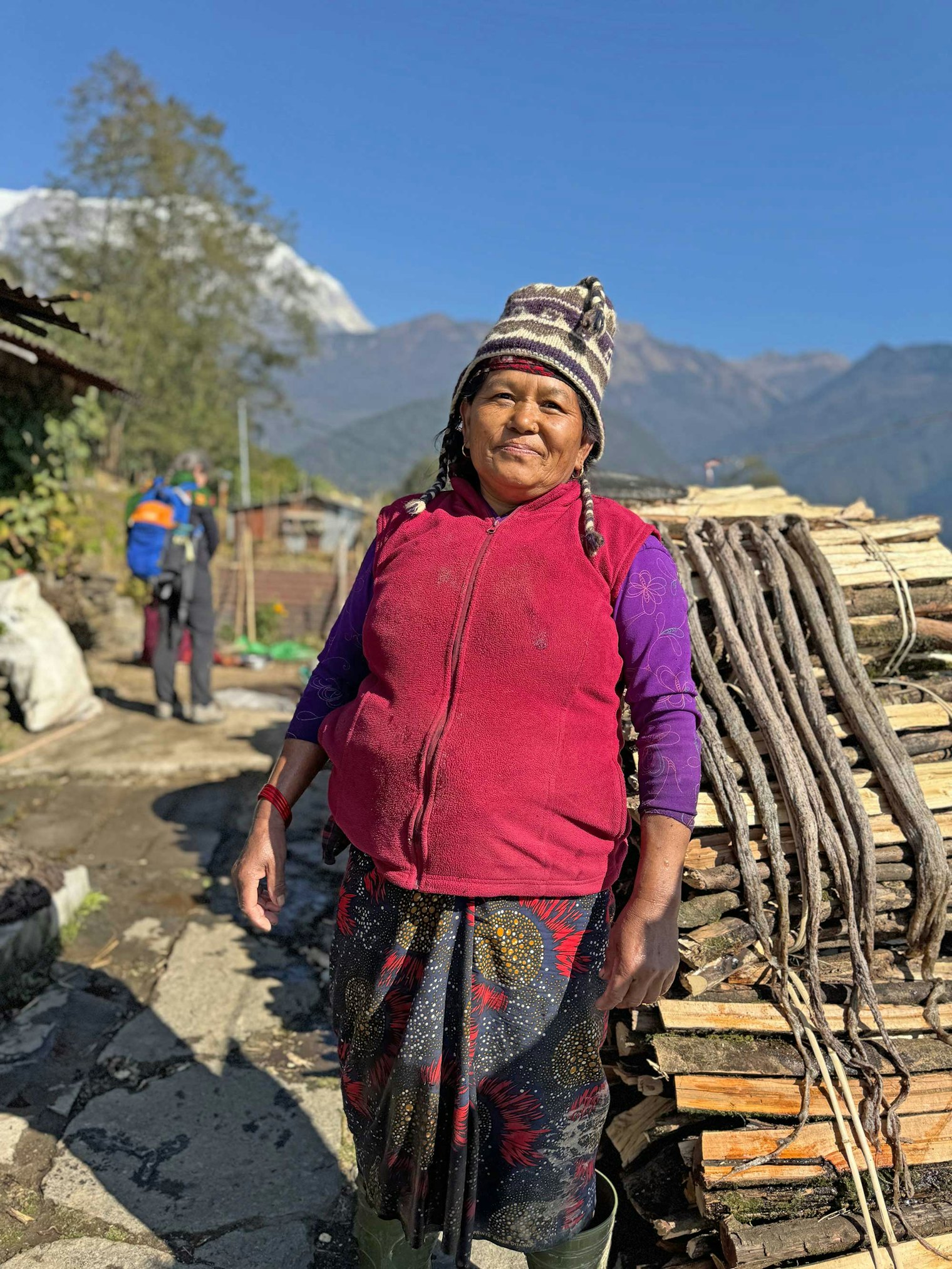Ginsuba Gurung stands next to her washed and pounded allo. Photo by Kathleen Mahoney