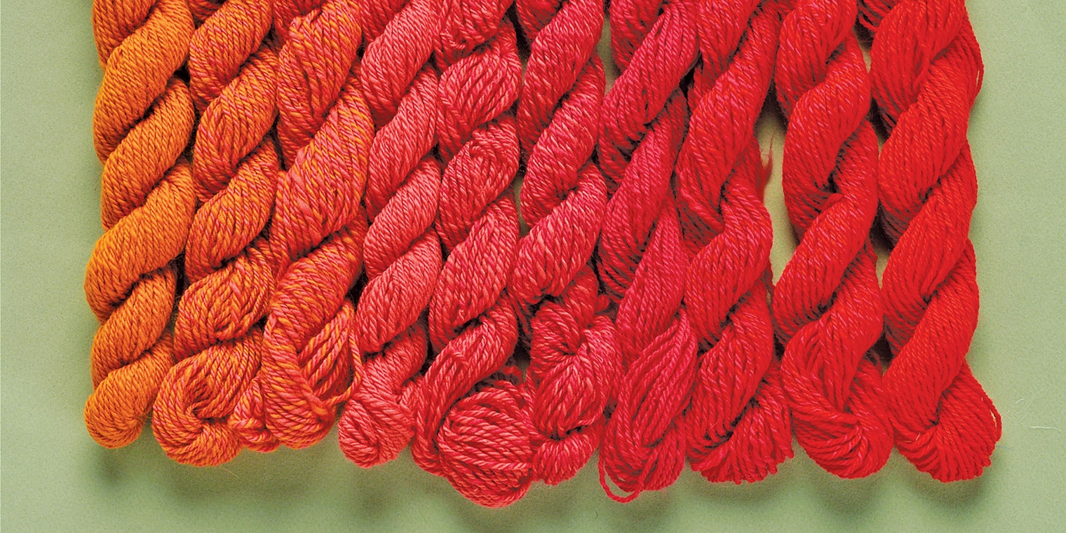 skeins of orange and red yarn
