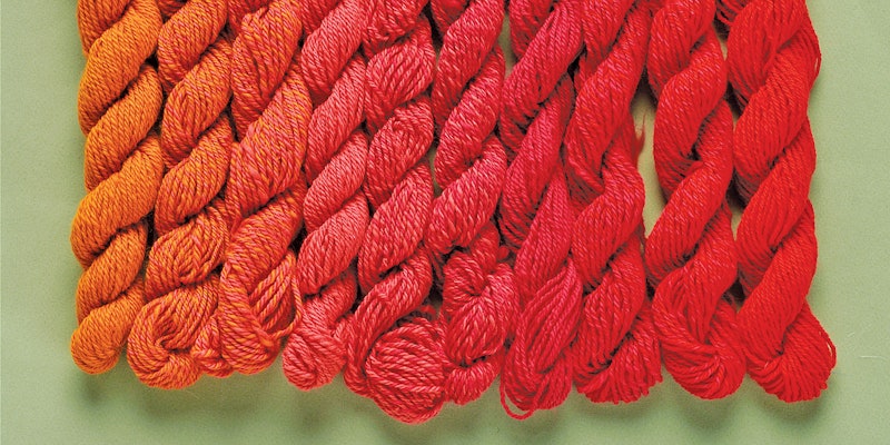 skeins of orange and red yarn