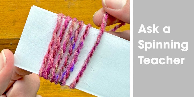 pink-purple yarn wound around a card