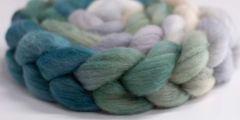 A braid of Falkland top in greens, blues, and grays.
