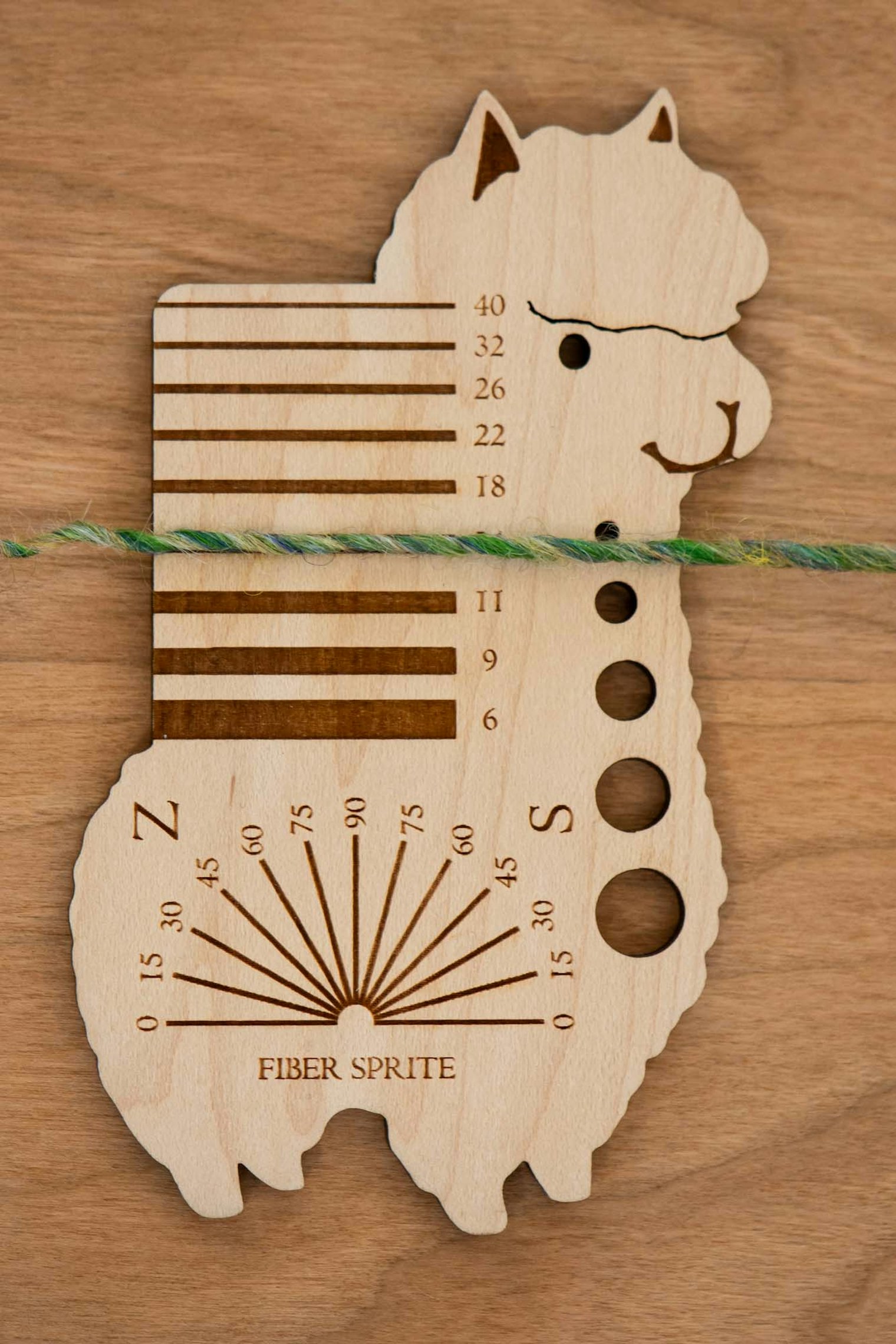Lay the yarn across the grooves until you find the right measurement.