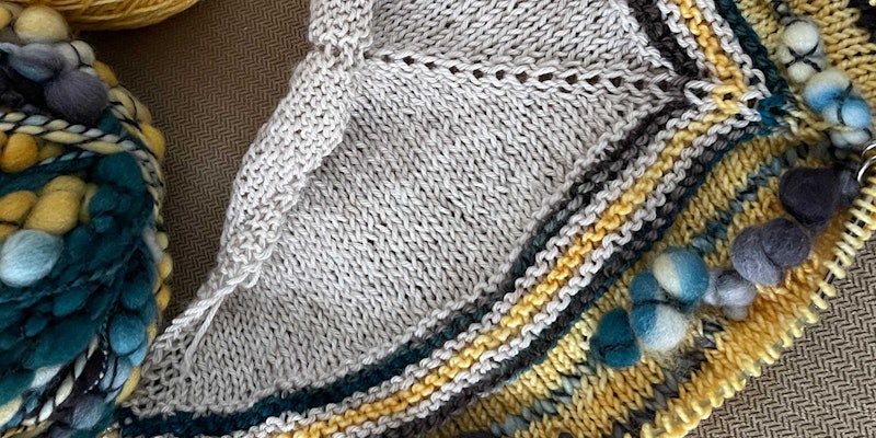 Blue textured yarn knit into portions of a yellow and gray shawl.
