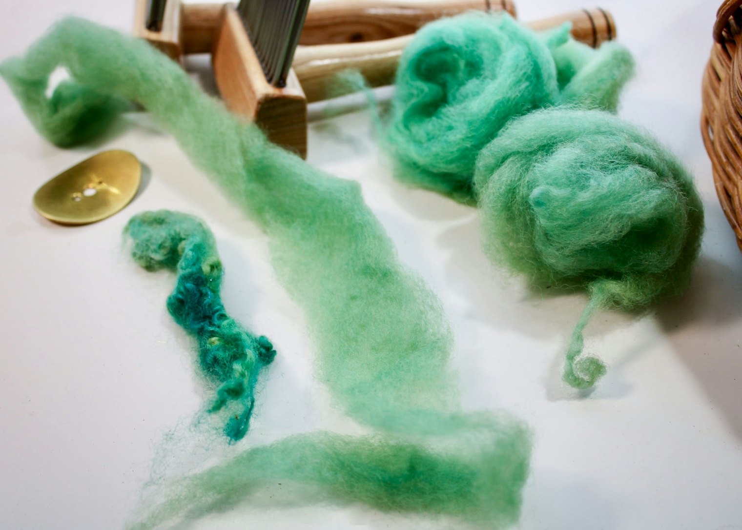 Debbie dyed this Finn fleece in shades of soothing green-grey, then combed and dizzed the locks for a worsted preparation.