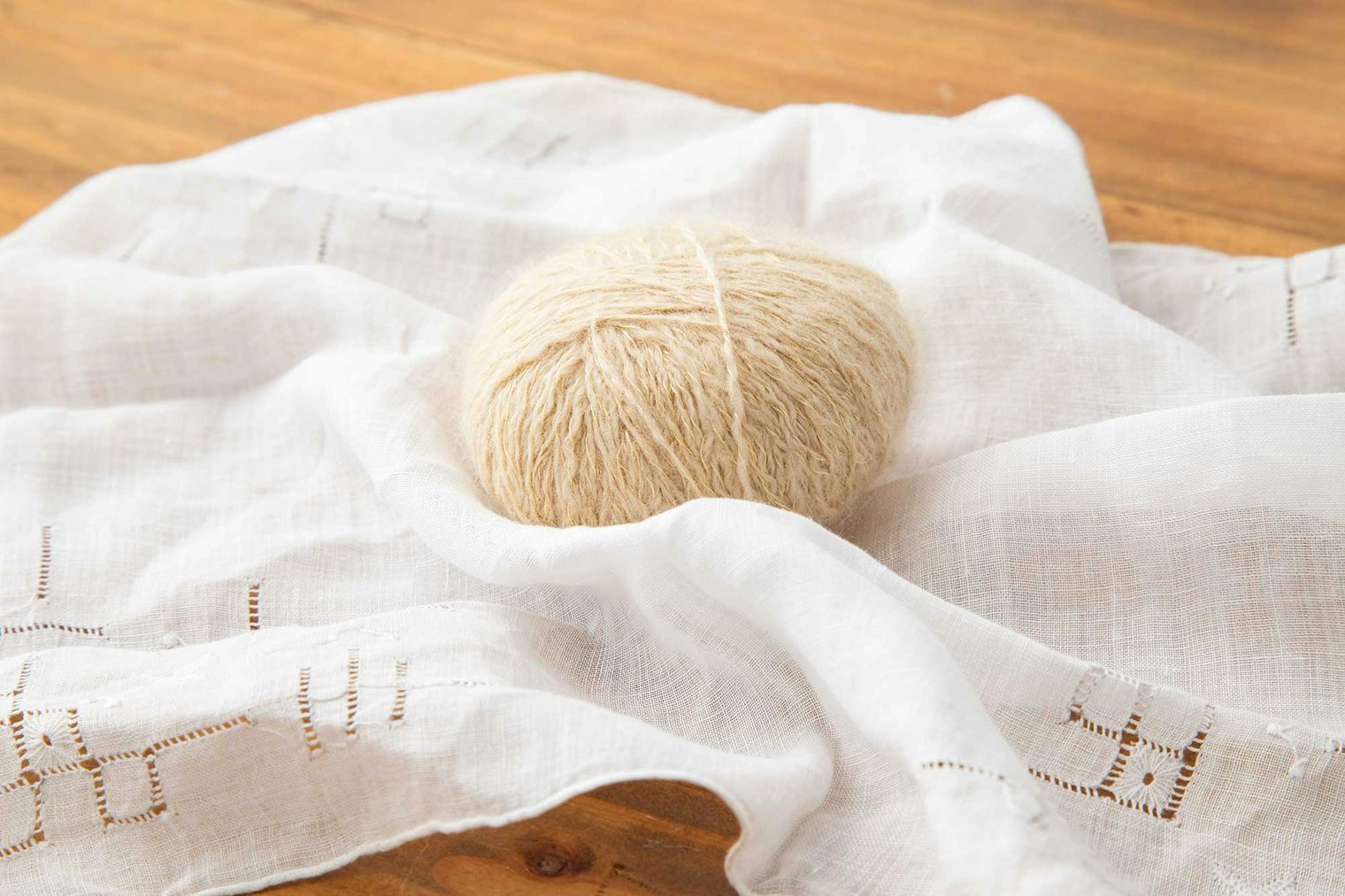 Plied yarn is wrapped in a handkerchief and steamed to set the twist.