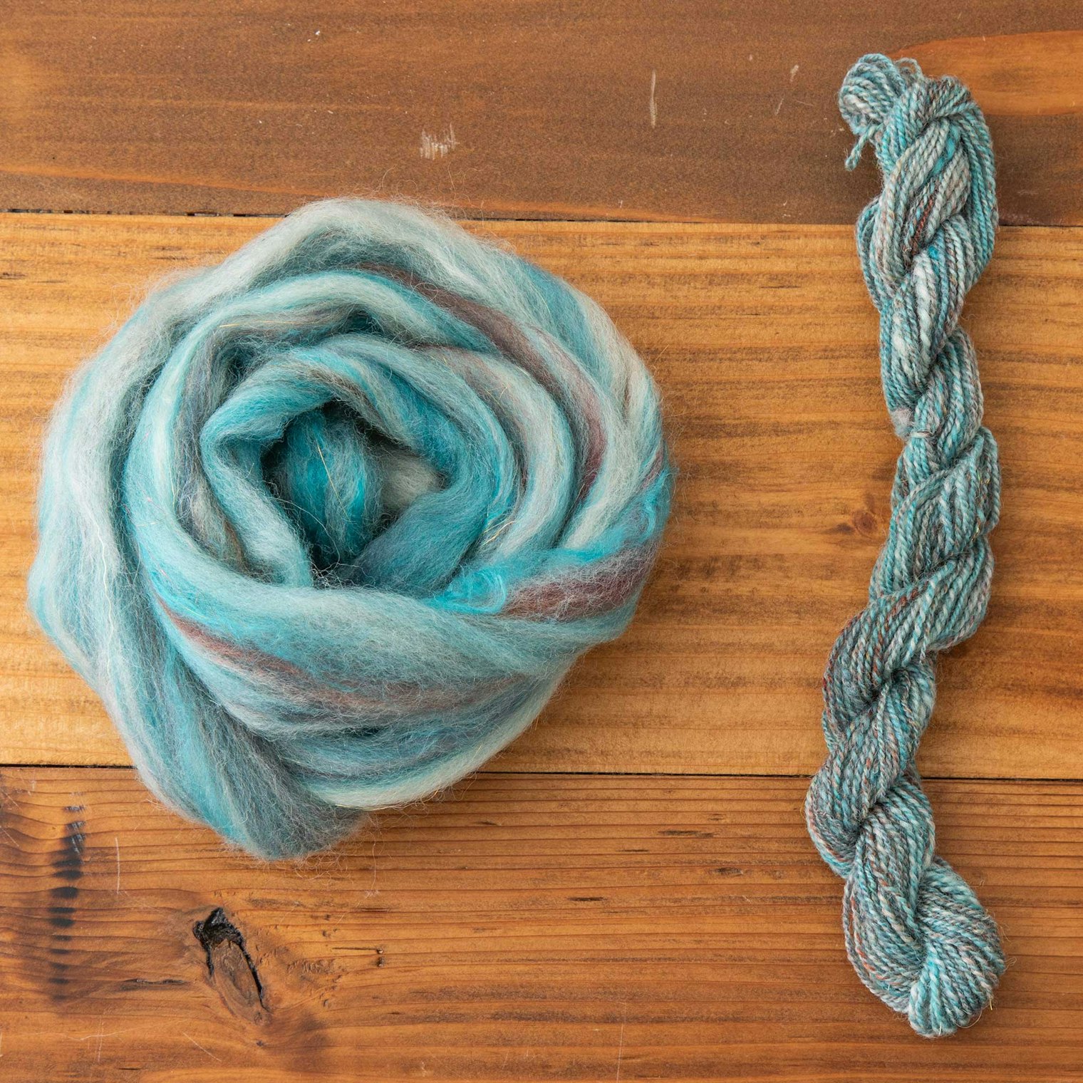 In this example, Debbie made roving from her heathered blend. Note that there is slightly more color variation in this yarn.