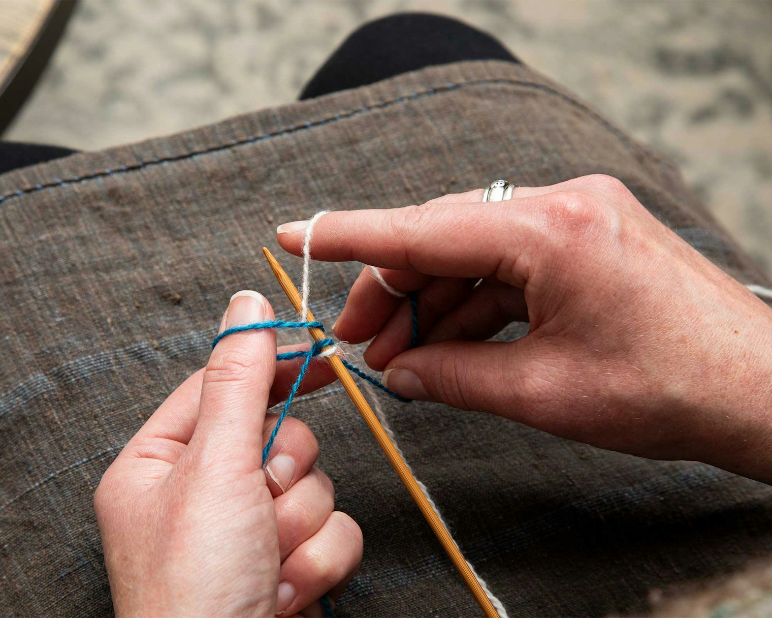 Take MC under CC and knit into the loop.