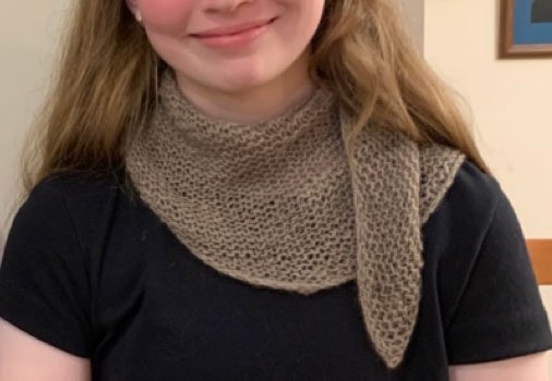Crescent Scarf 1 - All Garter Stitch. Photo and submission from Myrna Anne Itzen Stahman. "This is one pattern I really enjoy knitting with wonderful yarn and giving as gifts."