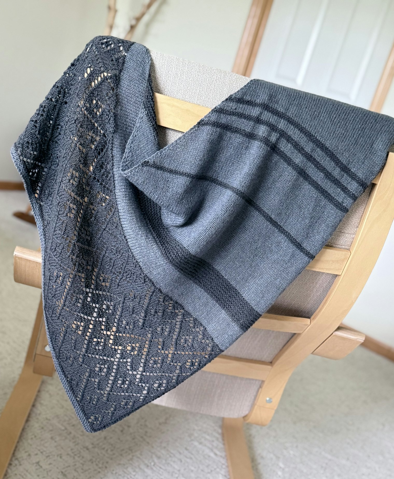 Glacial Story Shawl. Photo and submission from Kirstie Dye. "I designed a purposely pattern shifting shawl to go through time of moraine ridges, to striated rock, to lace work representing mountains with caught boulders."