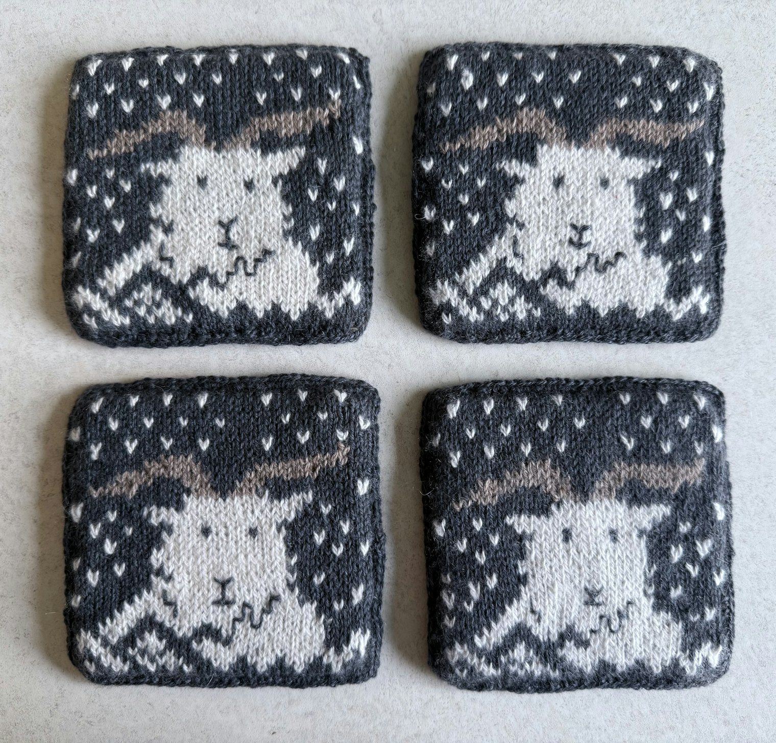 The G.O.A.T. Coasters. Photo and submission from Kirstie Dye. "This was also a fun color-work piece combining a skein of Ladakh Pangong Craft Center hand-spun white cashmere and with project ends of June Cashmere."