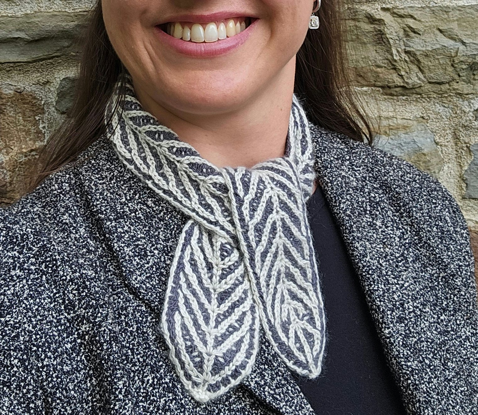 Glacial Point Scarf. Photo and submission from Gabrielle Augustine. "I knitting them together in a two-color brioche stitch, I used increases and decreases to create a mountain-and-valley pattern which pays homage to the glaciers and those inhabitants who rely on those ice sheets to make their living in the highlands."
