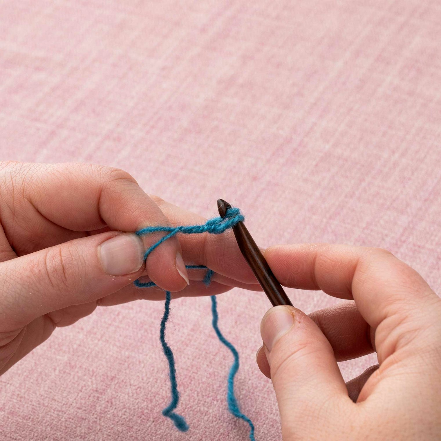 Pull the yarnover through the loop already on your hook.
