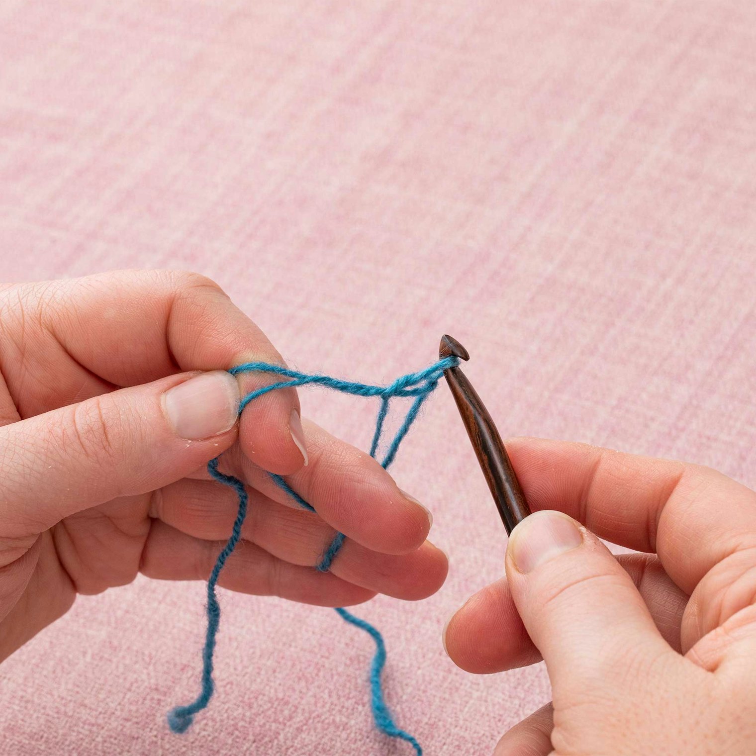 Pull the yarnover through the loop already on your hook. You’ve made your first stitch.