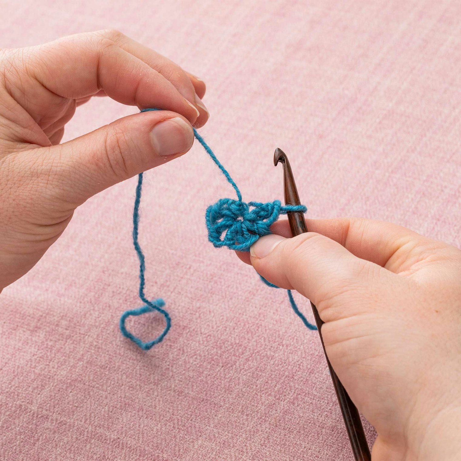 Once you have made as many stitches as you need for your pattern, pull the short tail tight to close up your magic ring.
