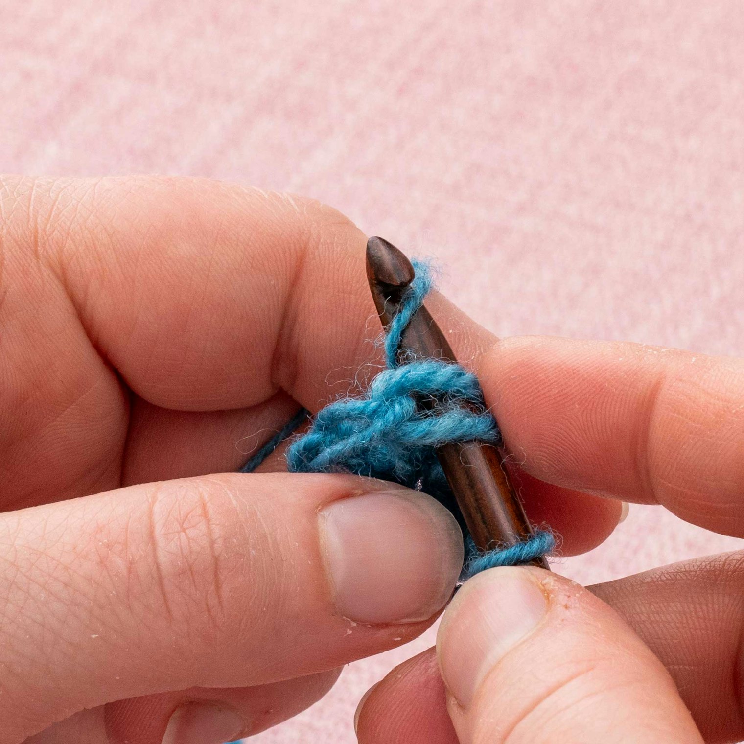 Make a yarnover, then pull it through to secure.