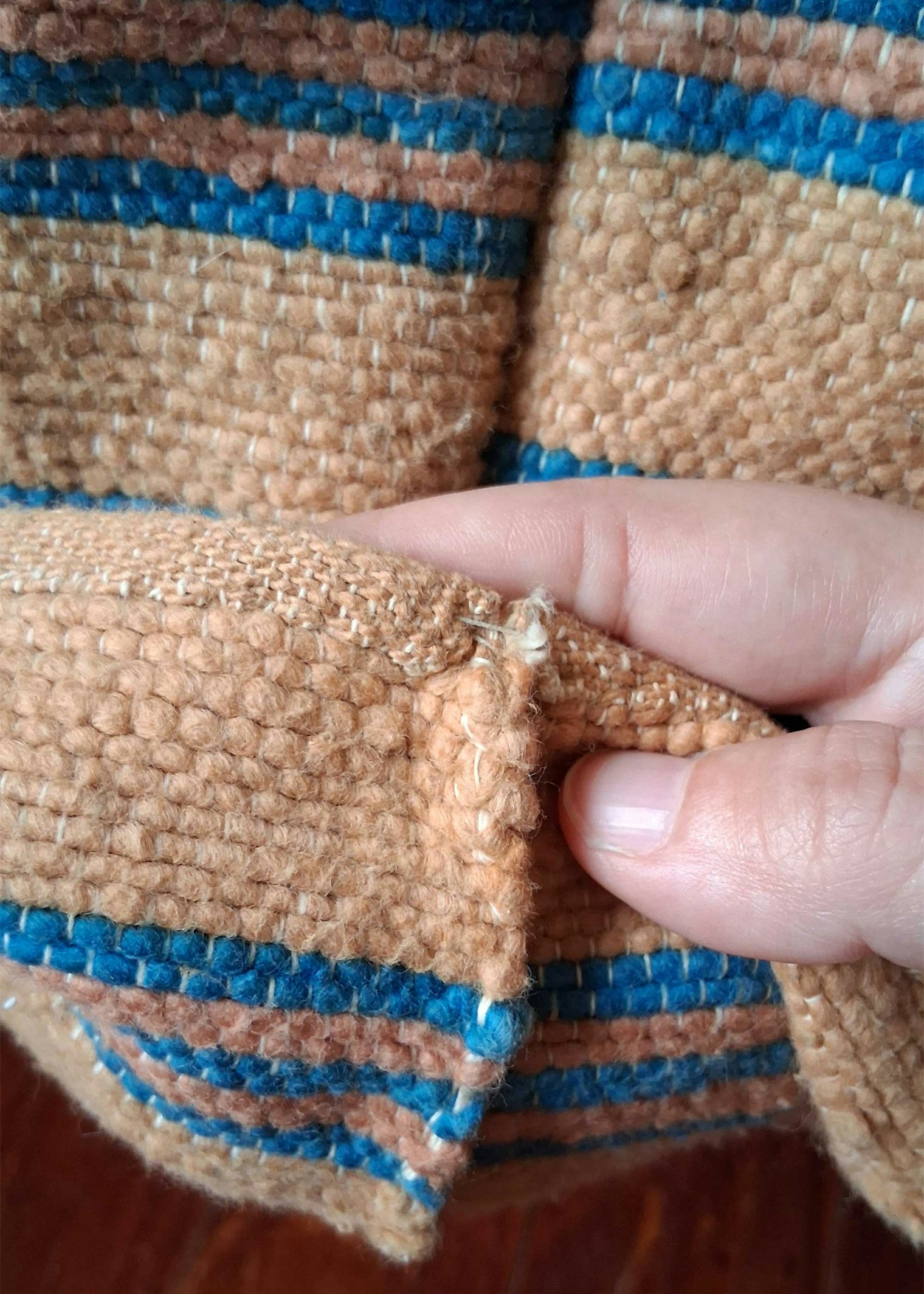 Note the indigo-dyed stripes on this Acadian brown cotton blanket.