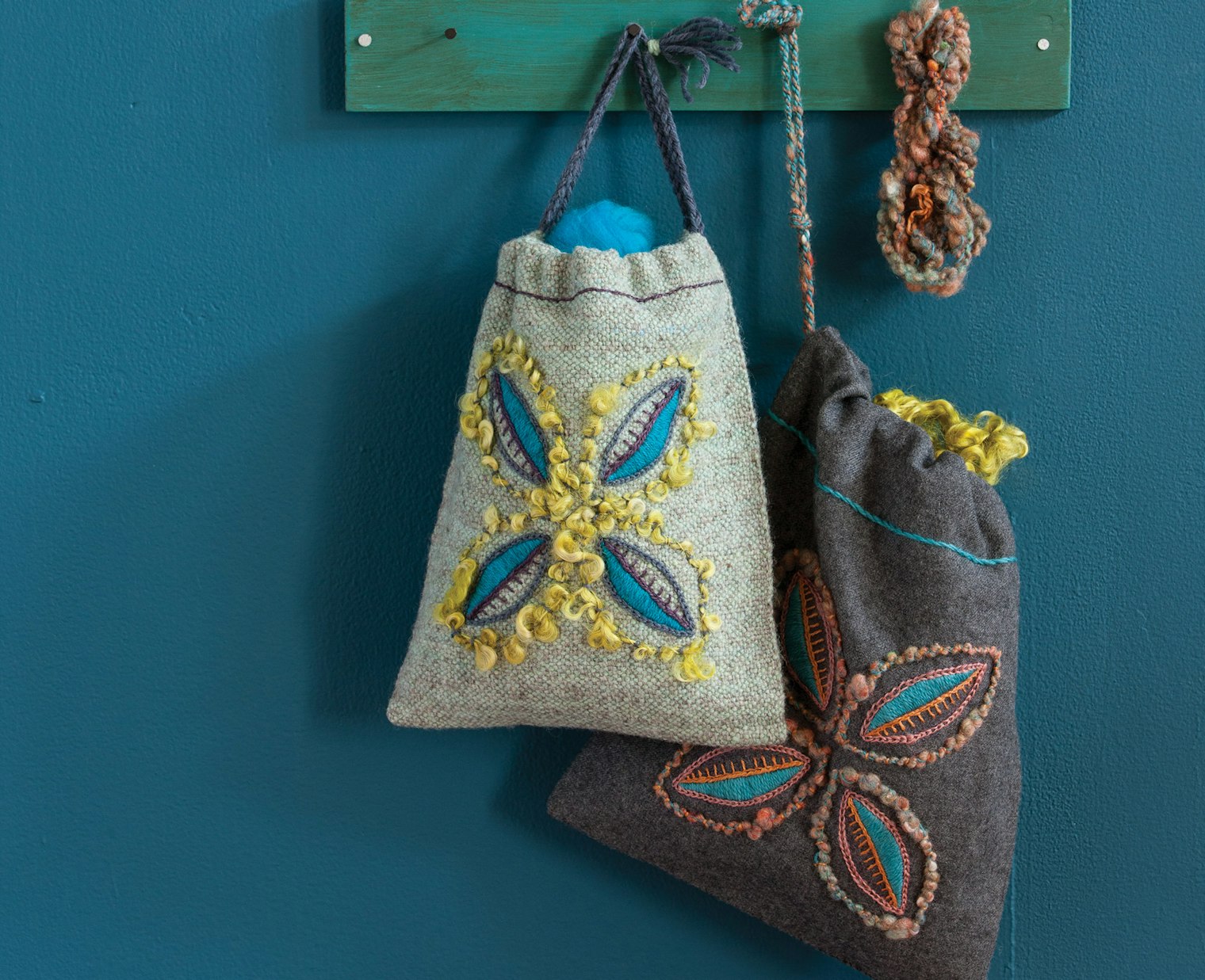 Two tote bags on a blue background.
