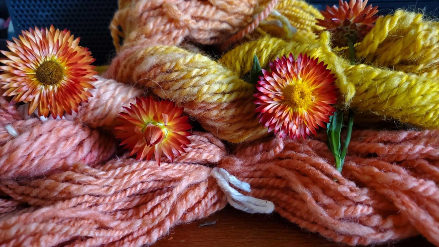 Pink, yellow, and orange yarn with cottage orange strawflower