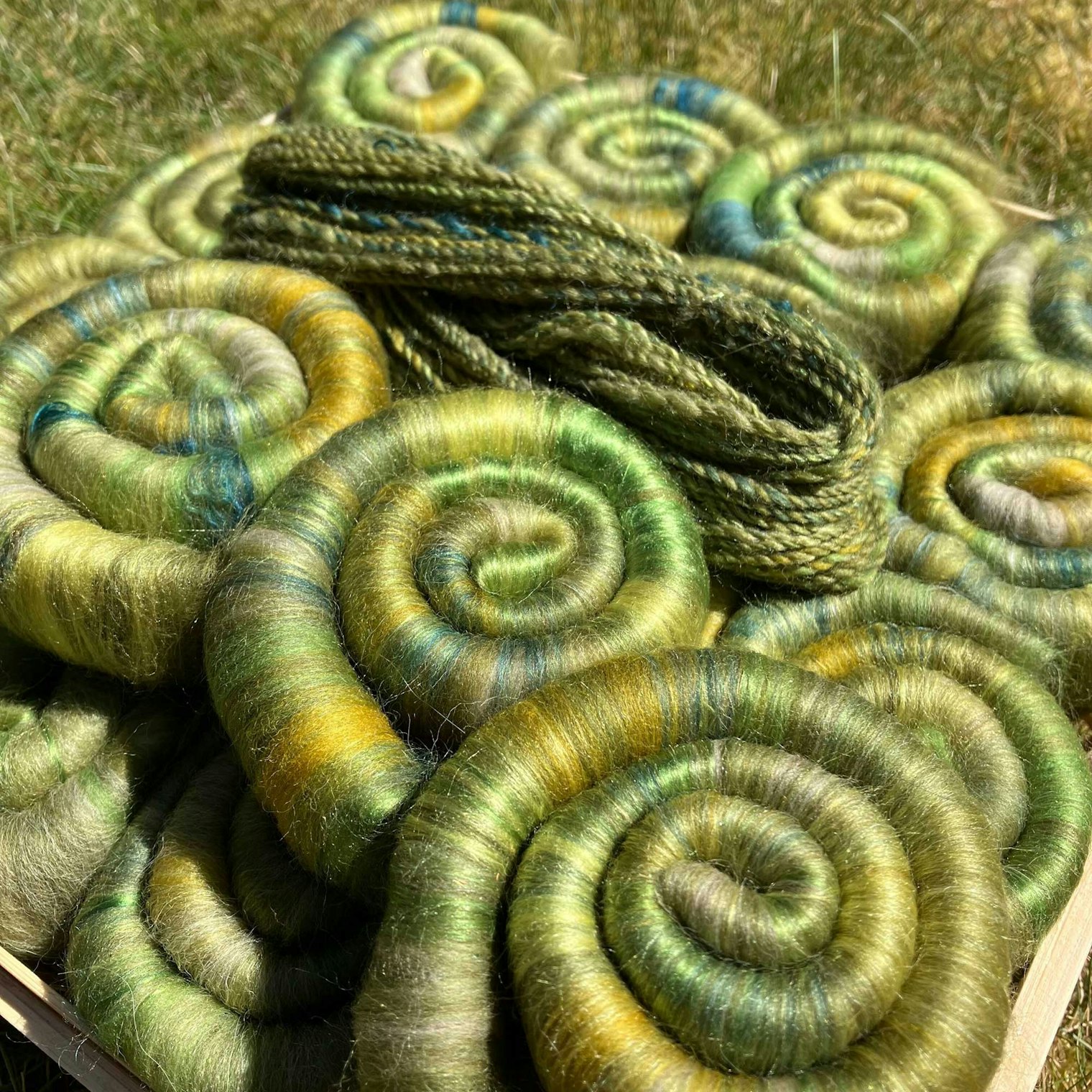 Olive Green rolags and yarn.