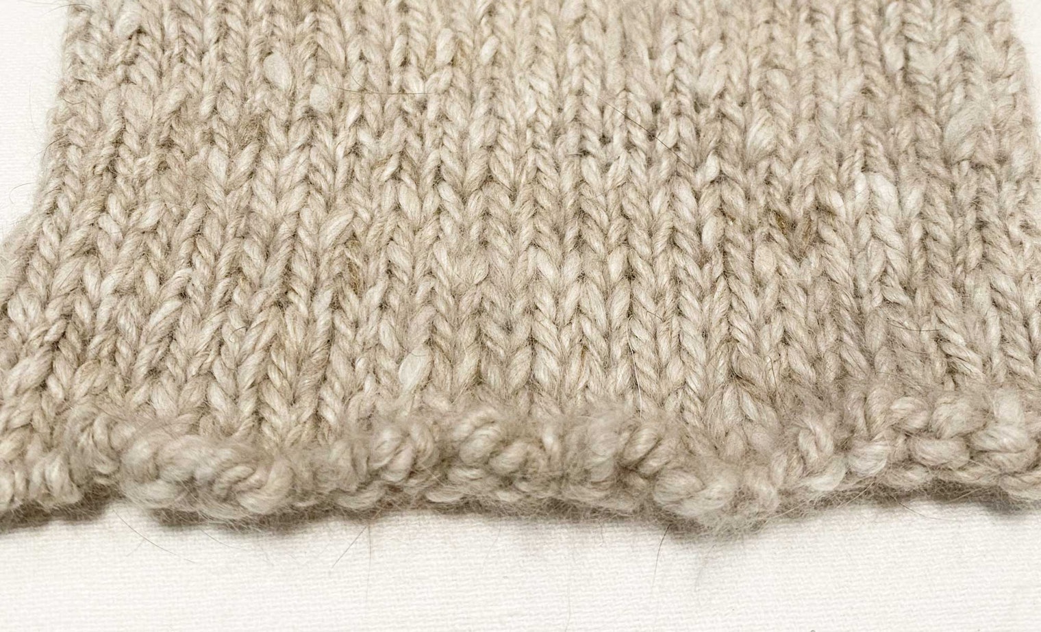 The knitted sample has ten percent silk, but significantly less halo.