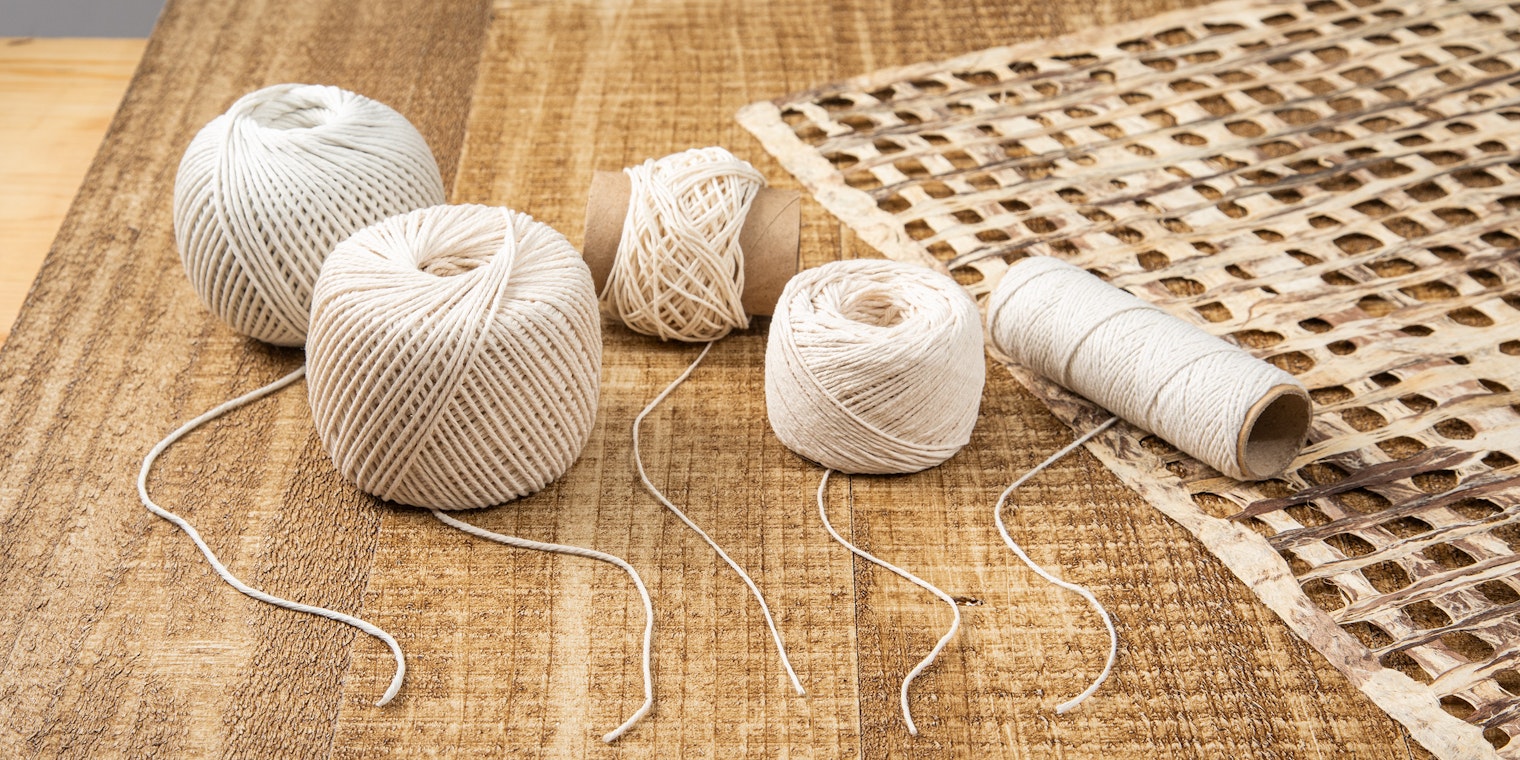 Four balls of various diameter cotton cord