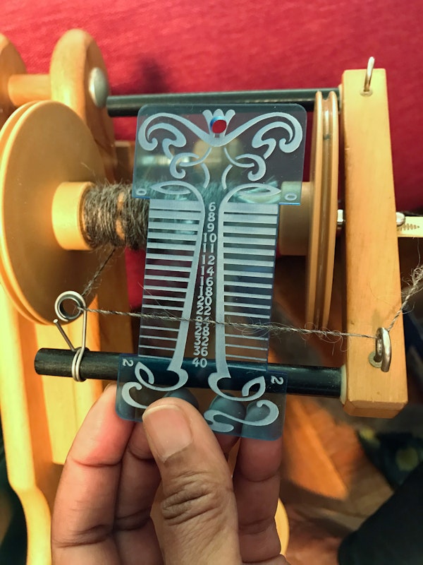 Step 2. Measure the size of the yarn. HipStrings grist tool shown here. Photo by Sahara Briscoe