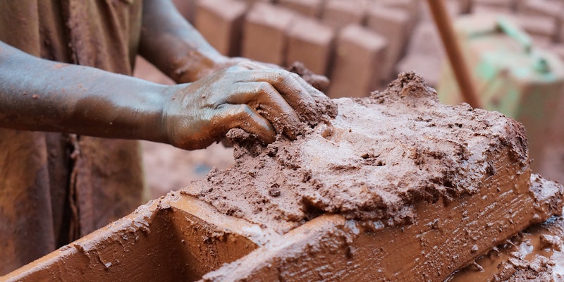 Person holding clay