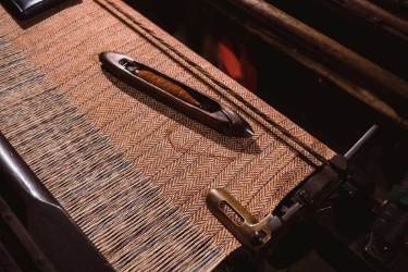 Brown cloth on loom