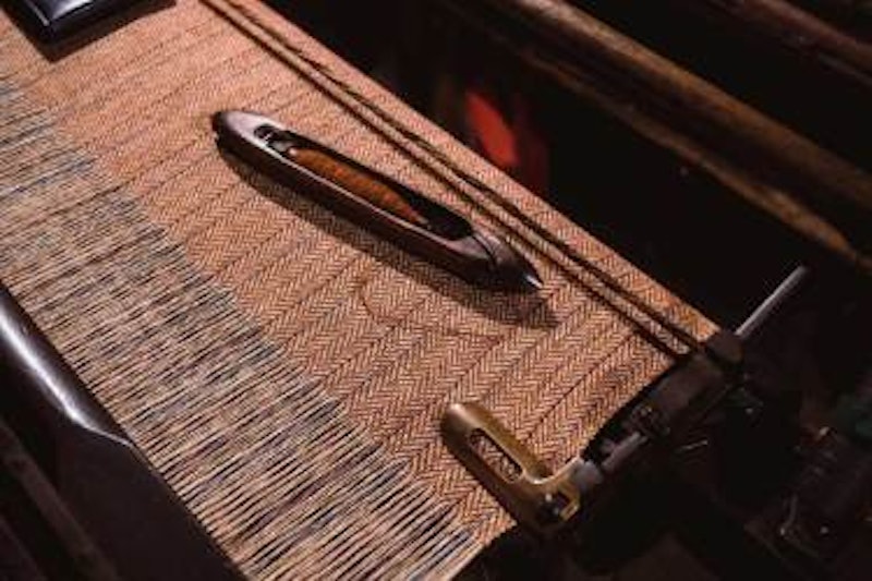 Brown cloth on loom