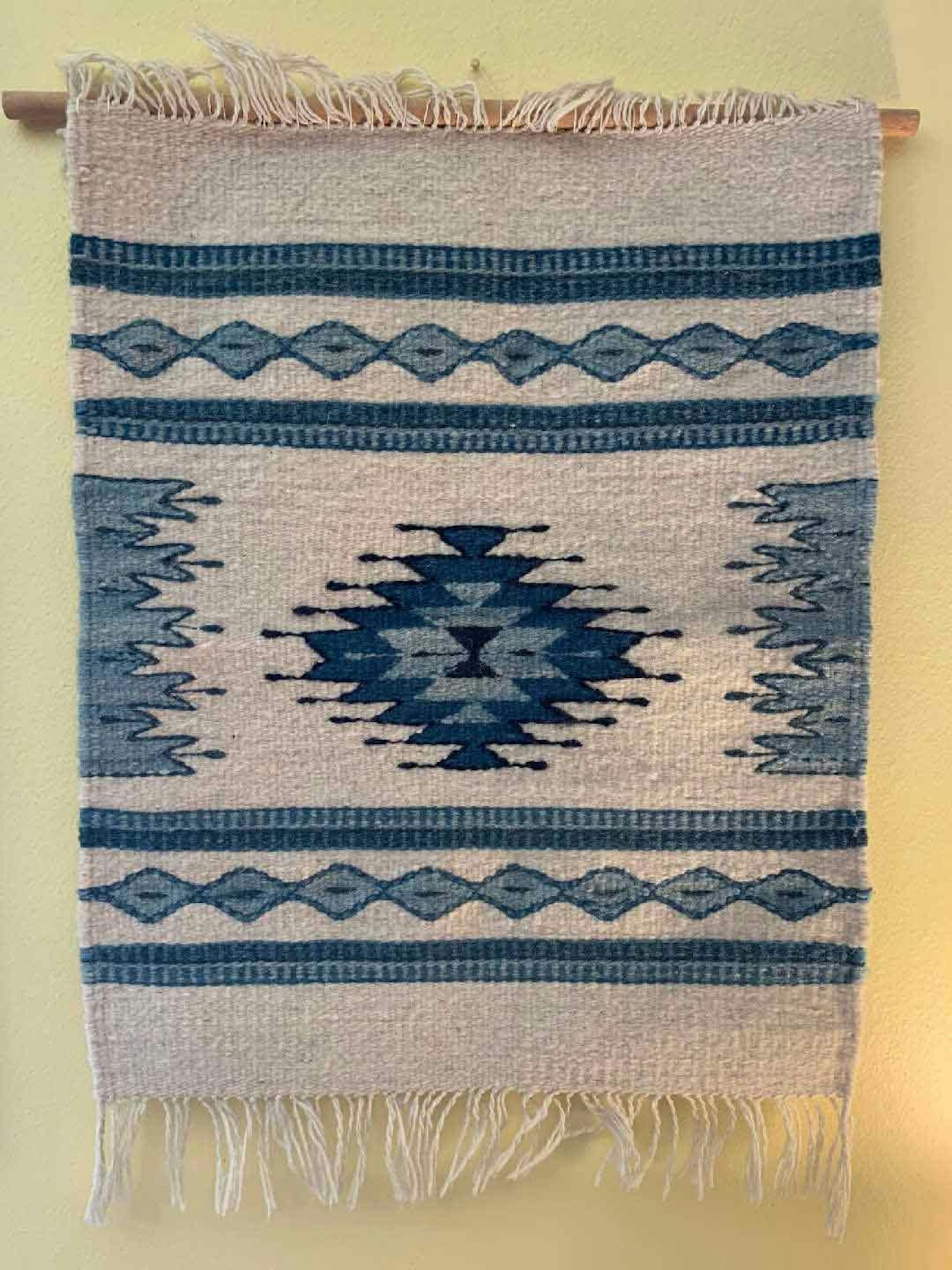 Small tapestry with dowel rod